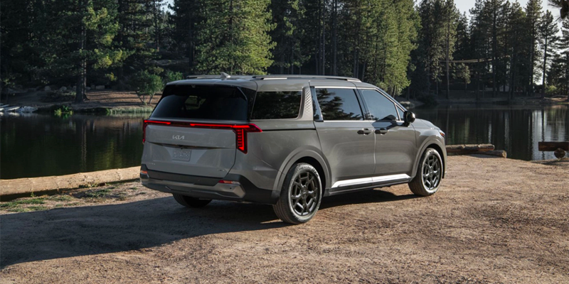 2025 Kia Carnival at a lake