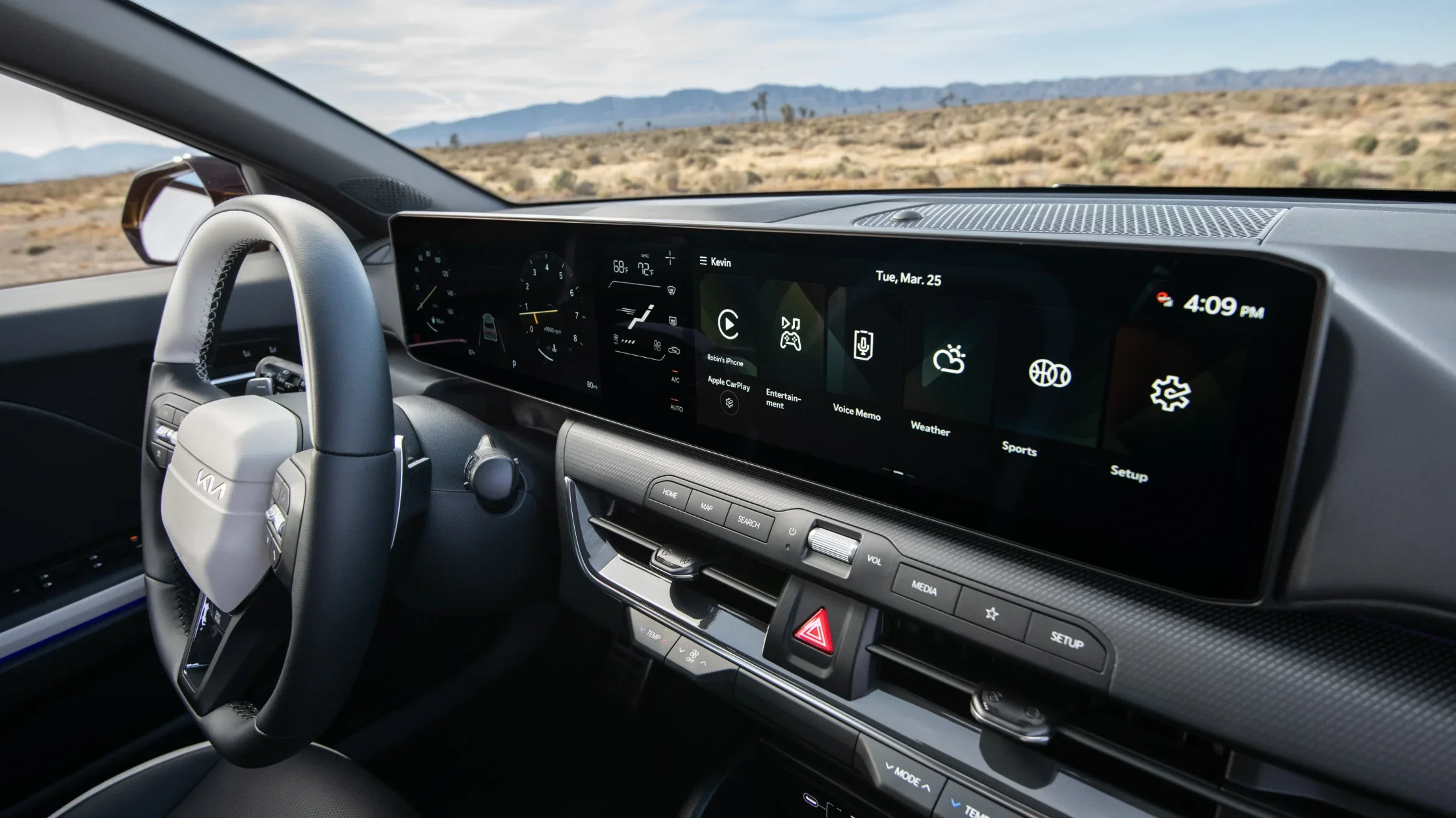 2026 Kia K4 Hatchback interior with digital display, leather steering wheel, and infotainment controls.