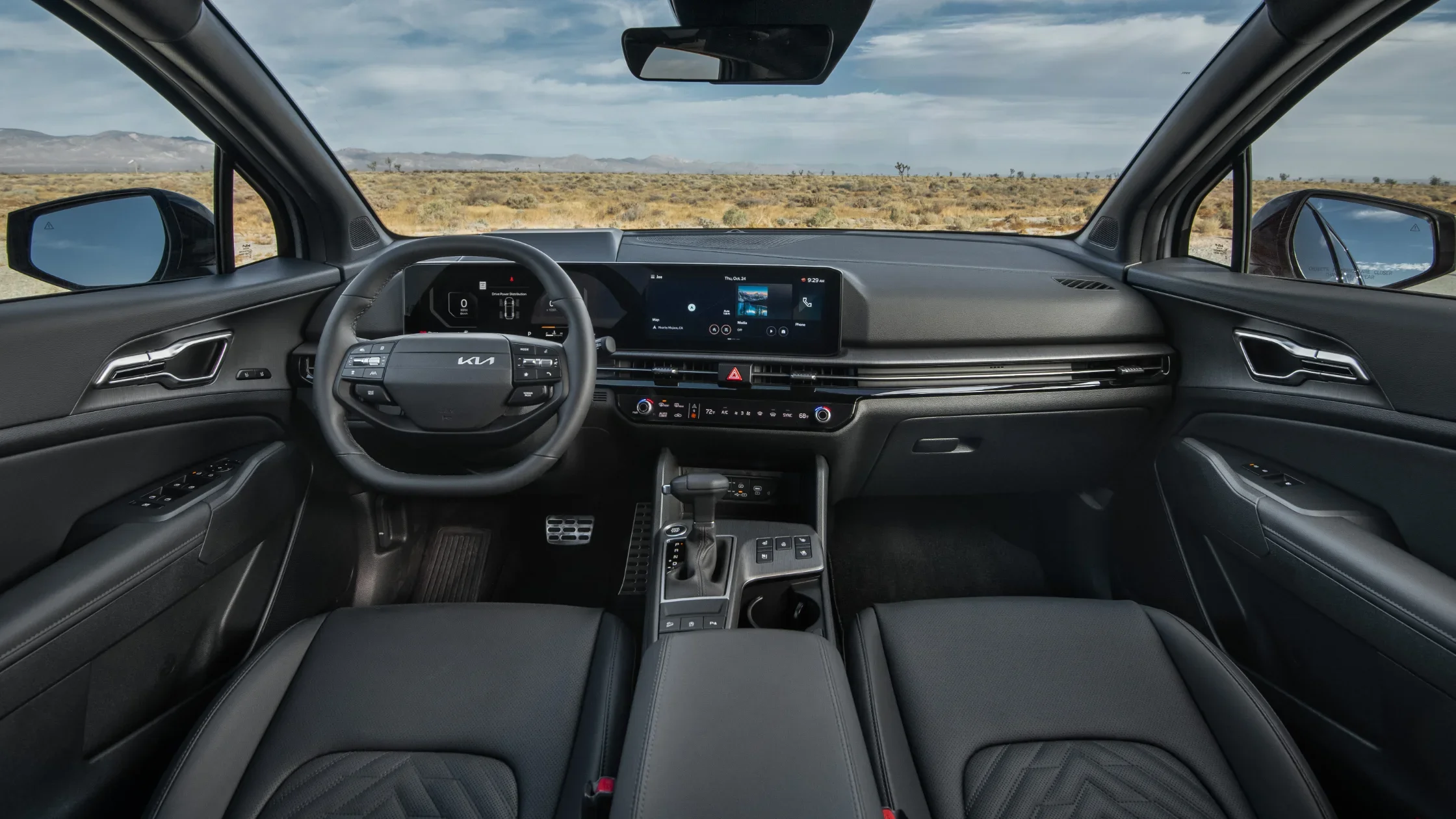 2026 Kia Sportage interior with digital cockpit, leather seats, and wide touchscreen display view.