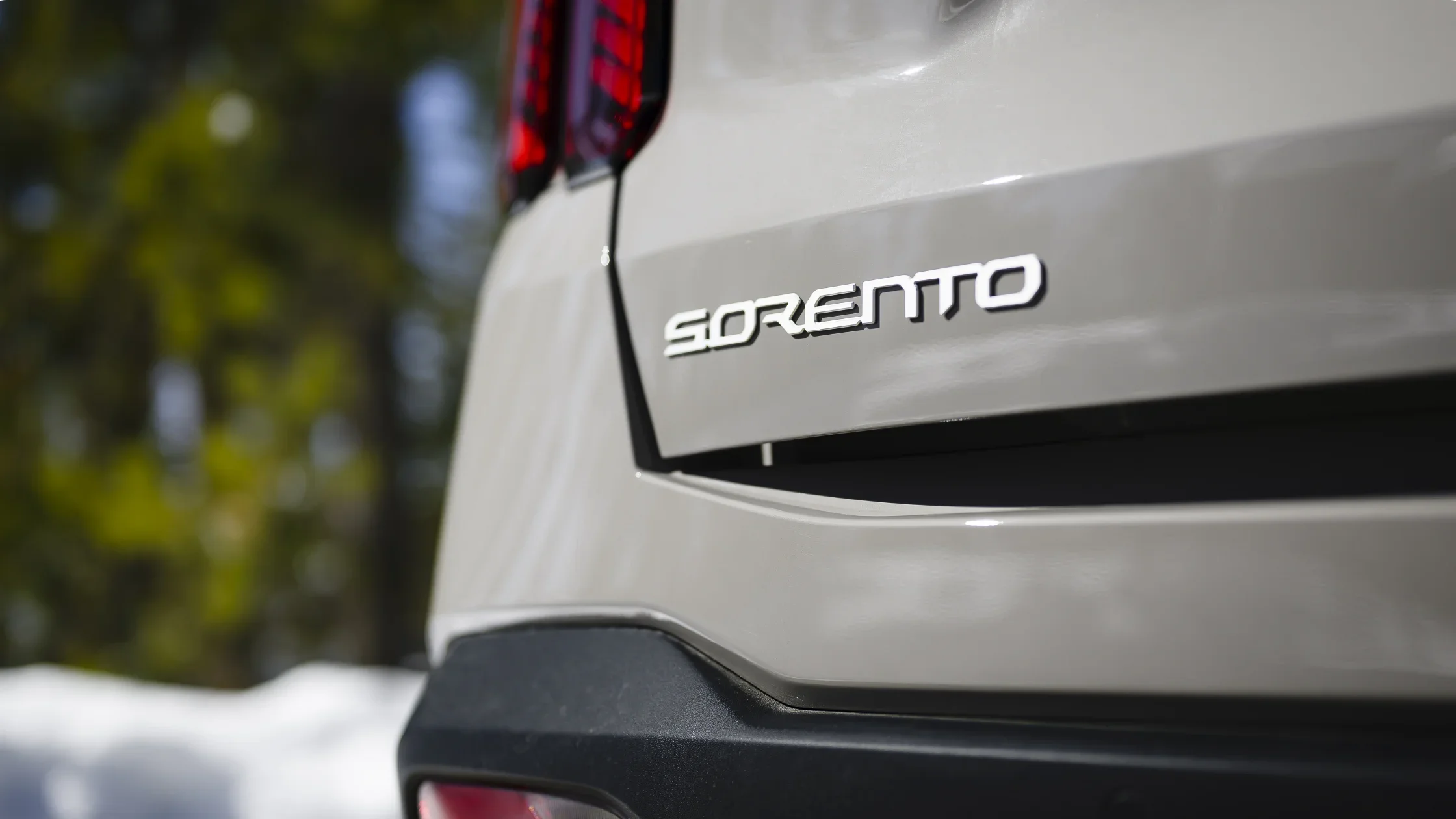 2026 Kia Sorento rear exterior detail highlighting Sorento badging and modern tail design.