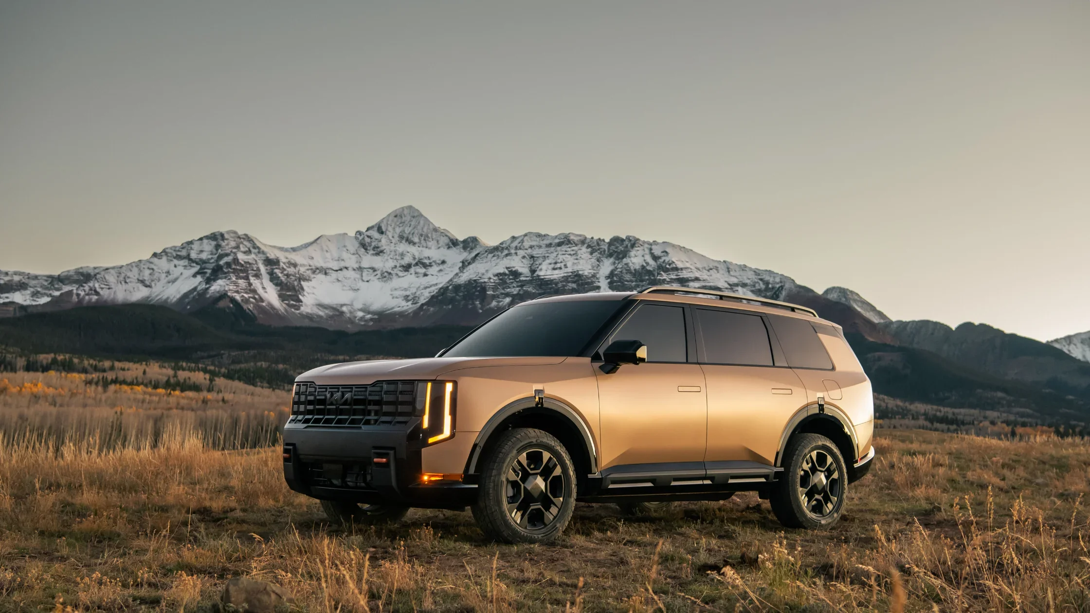 2027 Kia Telluride exterior parked in mountain landscape showcasing bold full size SUV design.