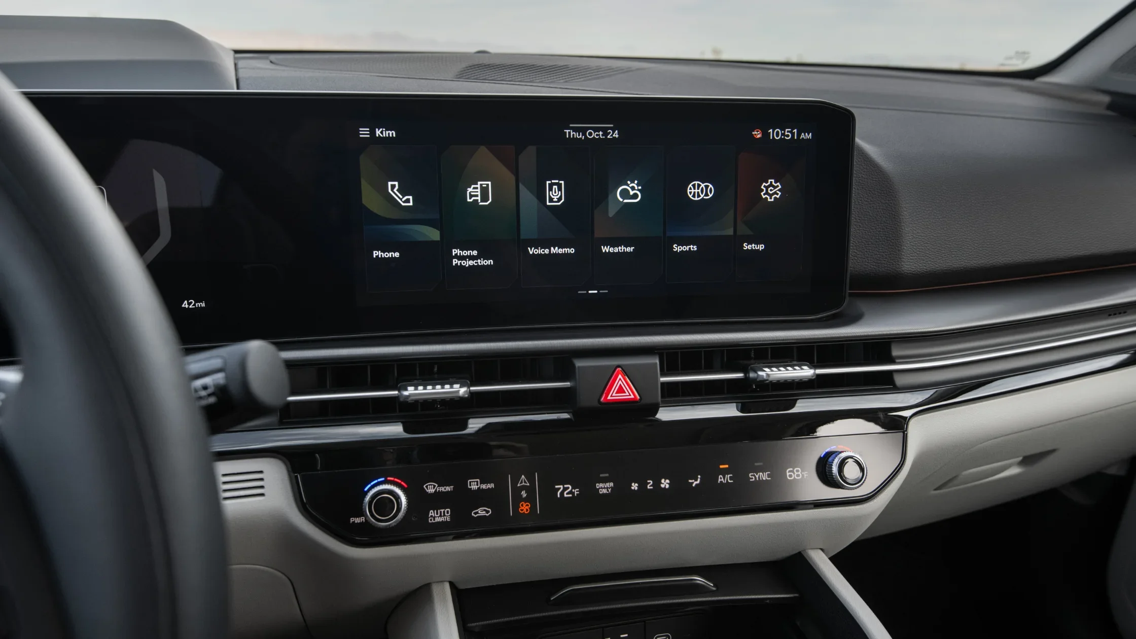 2026 Kia Sportage HEV interior close-up showing touchscreen display and climate control panel.